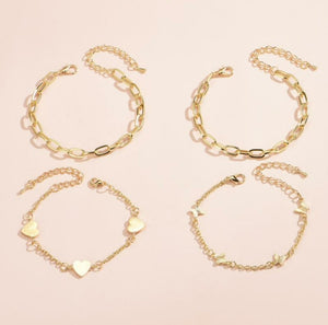 Bracelet 4 pièces avec médaillons coeur